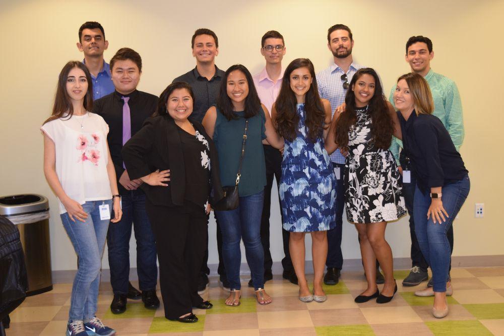 Group of twelve Armanino employees smiling