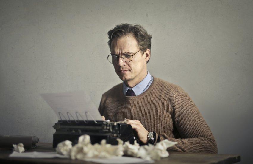 Man working on a typewriter