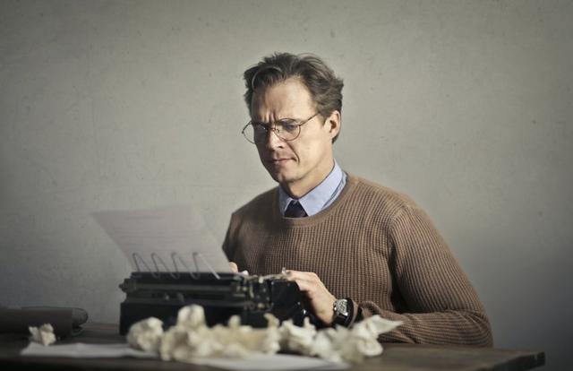 Man working on a typewriter