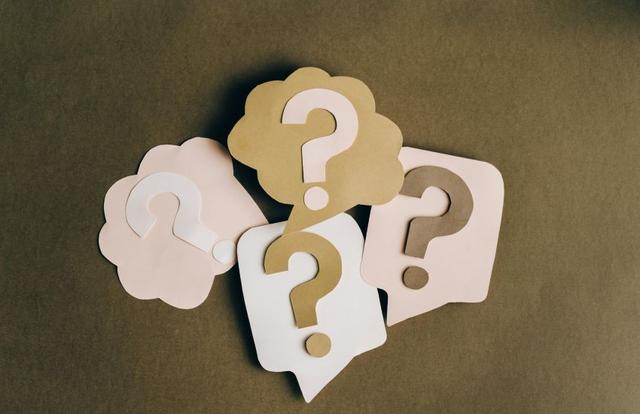 question marks cut out of paper