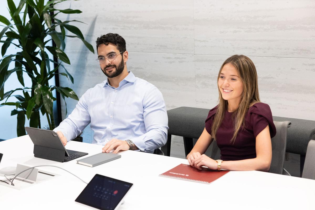 two coworkers attending a meeting