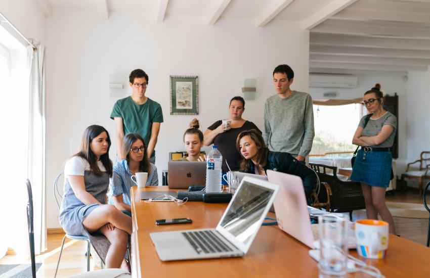 Group of People Watching on Laptop.